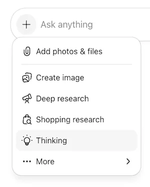 ChatGPT žinutės laukelis su atidarytu „+“ meniu: Add photos & files, Create image, Deep research, Shopping research, Thinking ir More