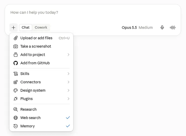Claude žinutės laukelis su atidarytu „+“ meniu: Upload or add files, Take a screenshot, Add to project, Add from GitHub, Skills, Connectors, Design system, Plugins, Research, Web search, Memory